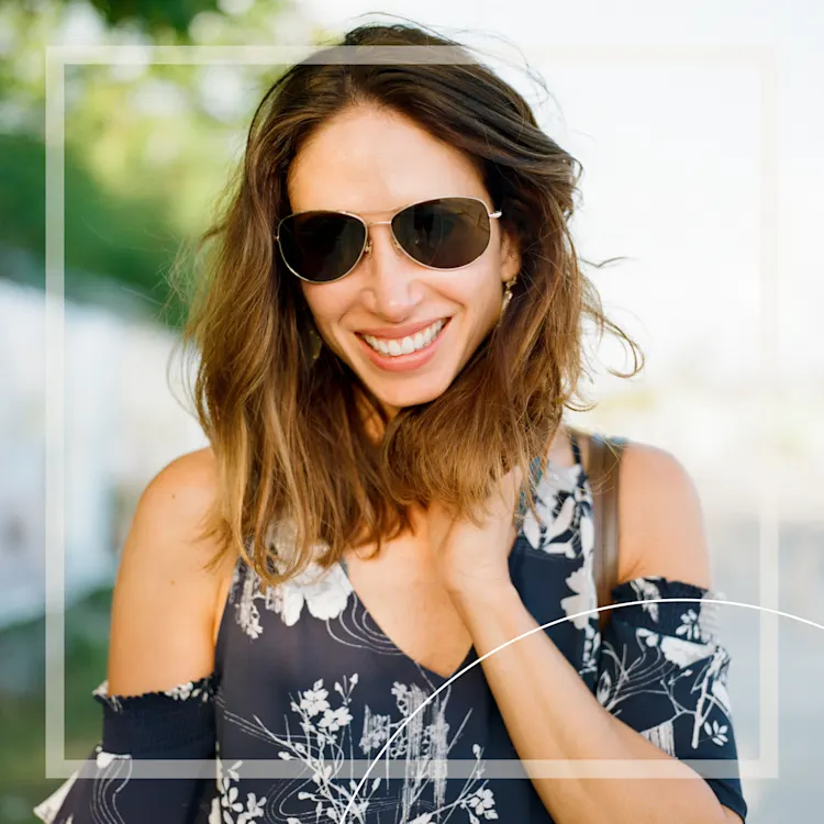 Lady with sunglasses smiling