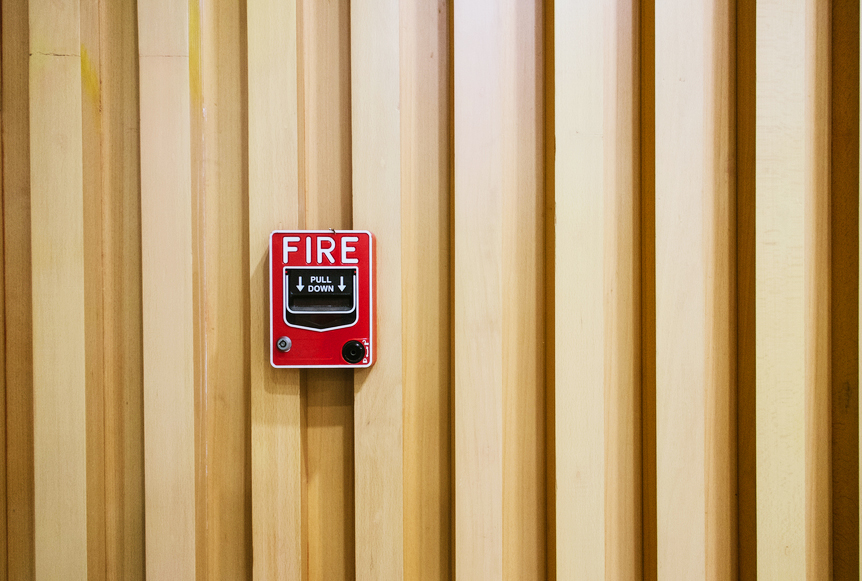 AW101 What Causes Hot Flashes? (3) (photo of fire alarm on outdoor wall)