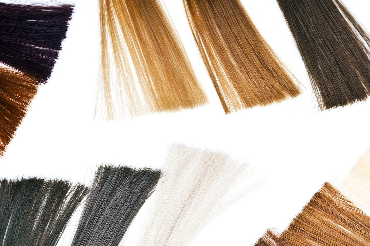 Hair extension samples of various colors on white background. AW460