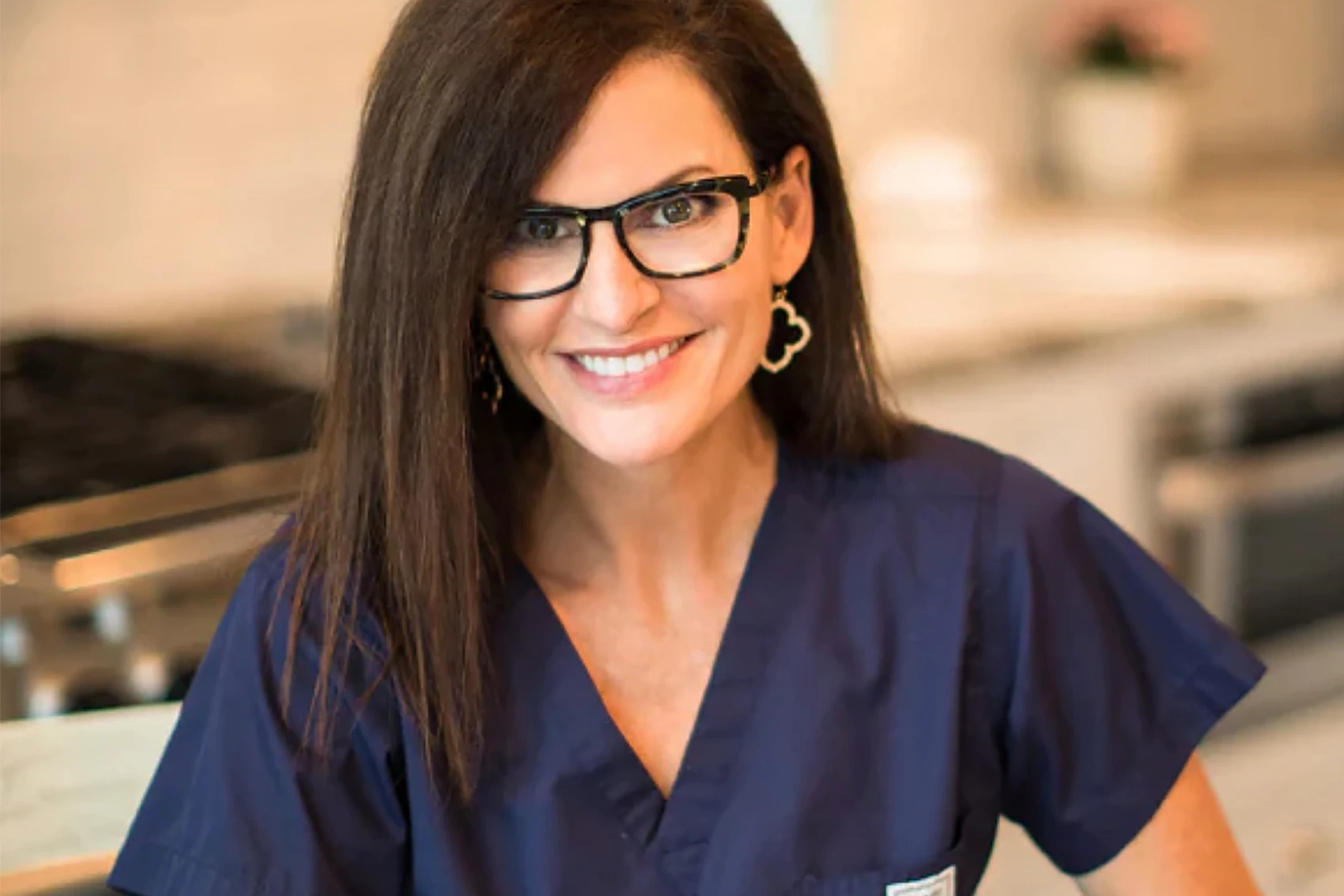 Dr Mary Claire Haver portrait in navy blue scrubs header