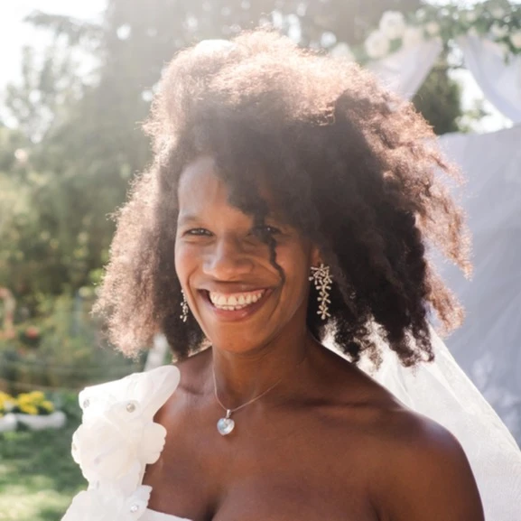Black woman in wedding dress, natural hair, smiling. AW256 