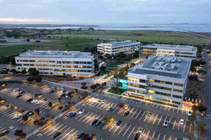 An aerial view of an office building at dusk.
