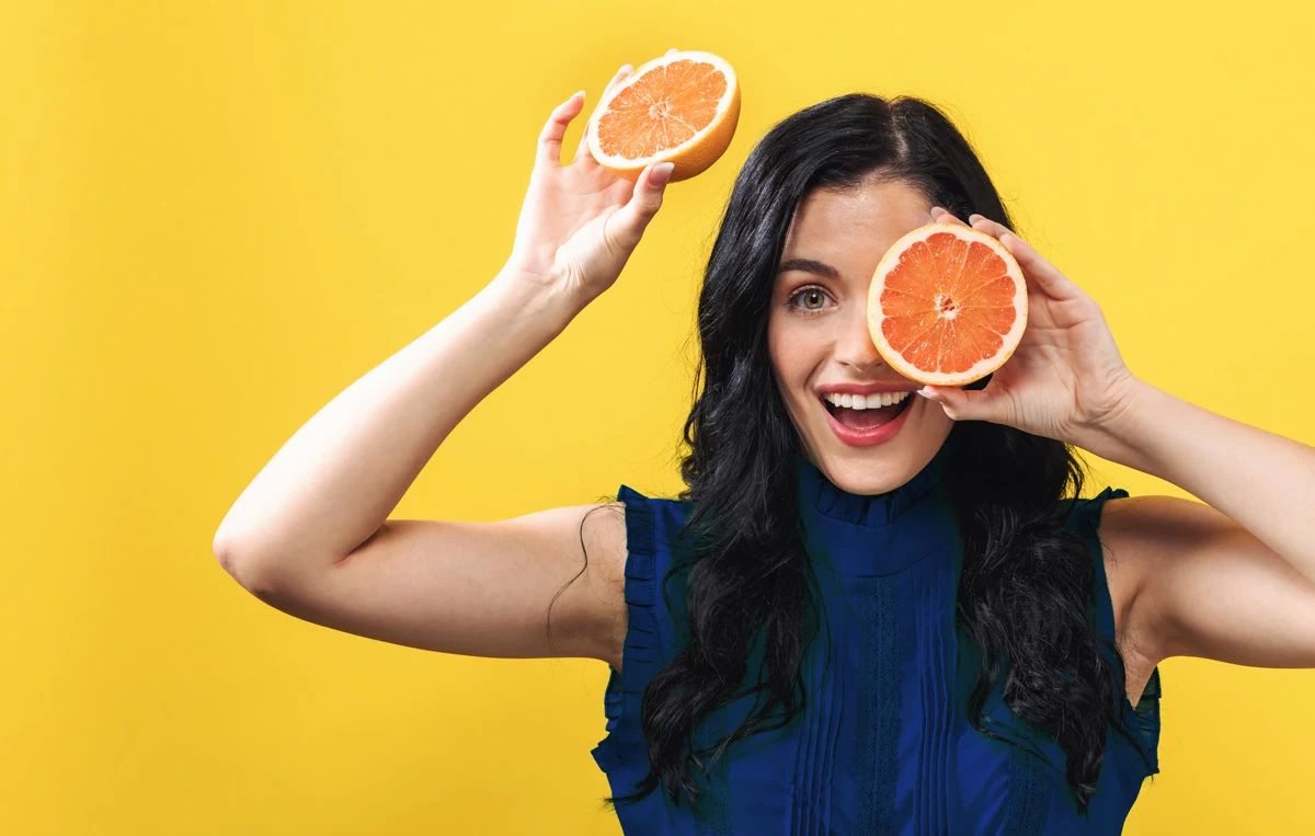 Woman with foods that trigger acid reflux