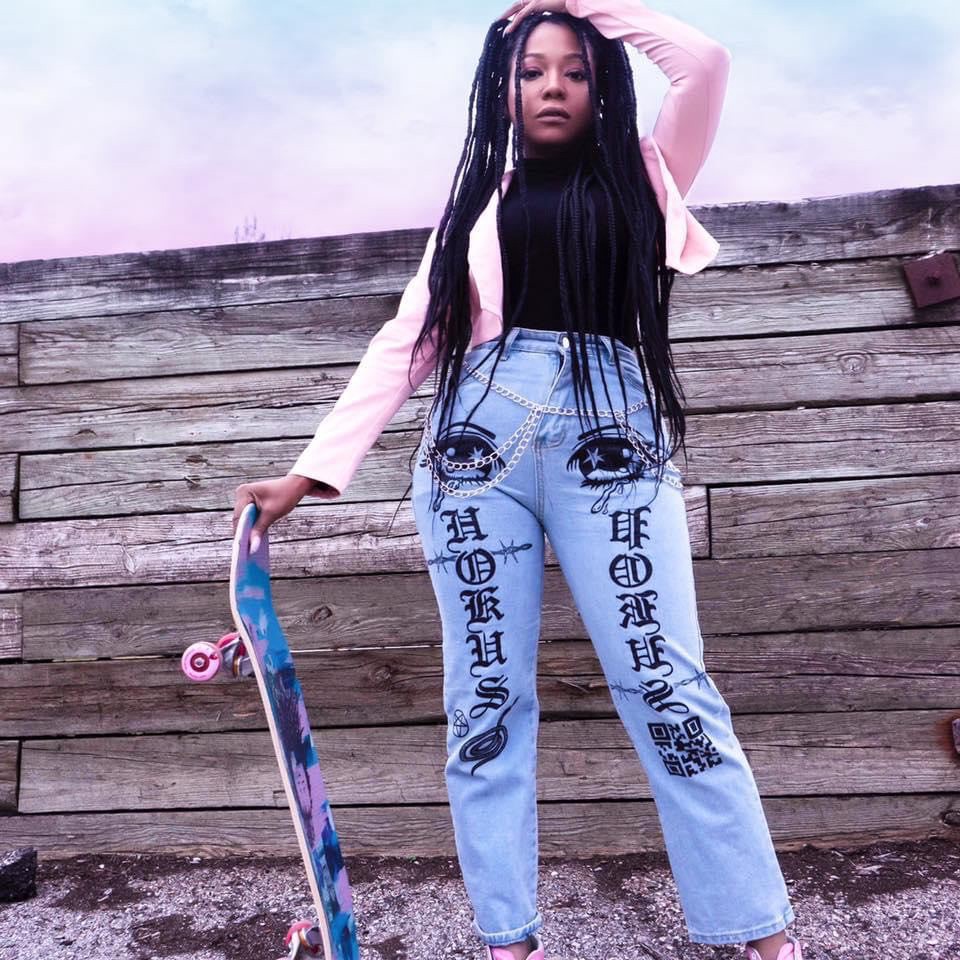 Woman holding skateboard