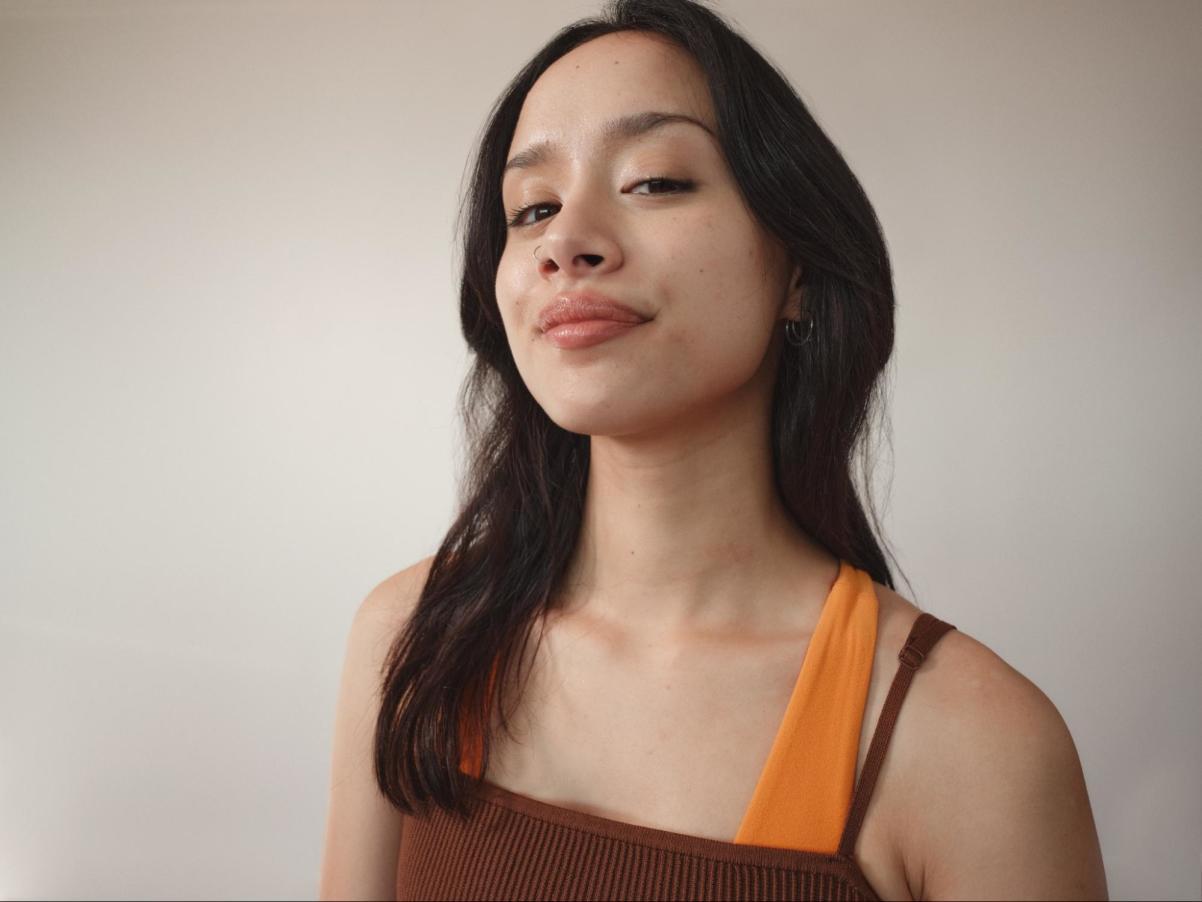 A Woman with Clear Skin Looking at the Camera