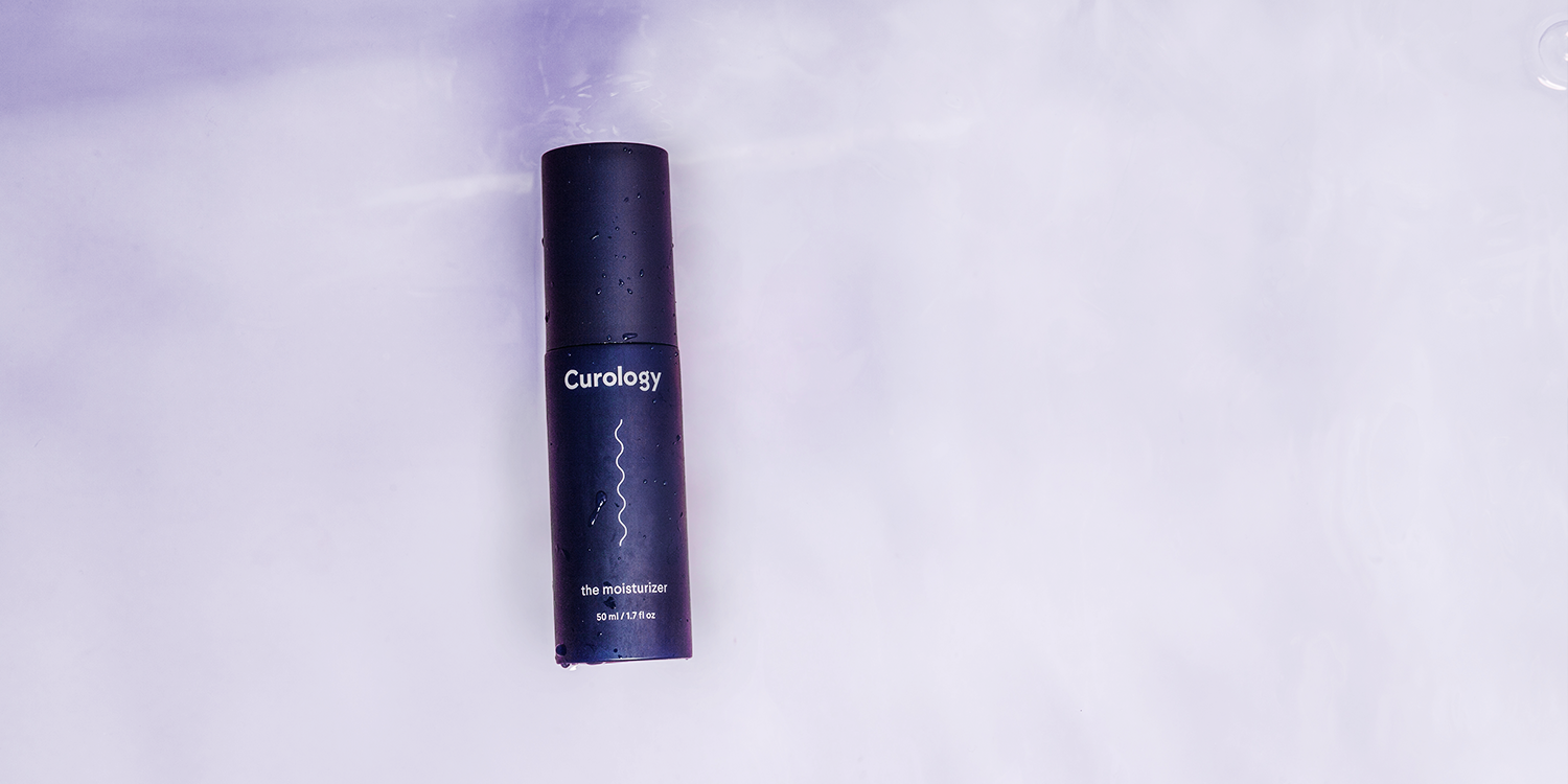 Curology moisturizer bottle floating ni purple water