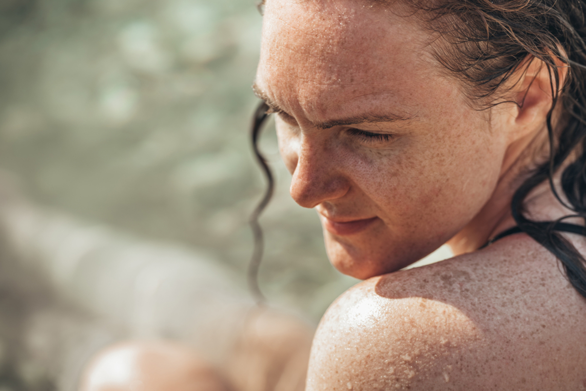 young woman with freckles on her face