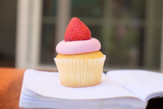 Closeup of cupcake with stawberry on top