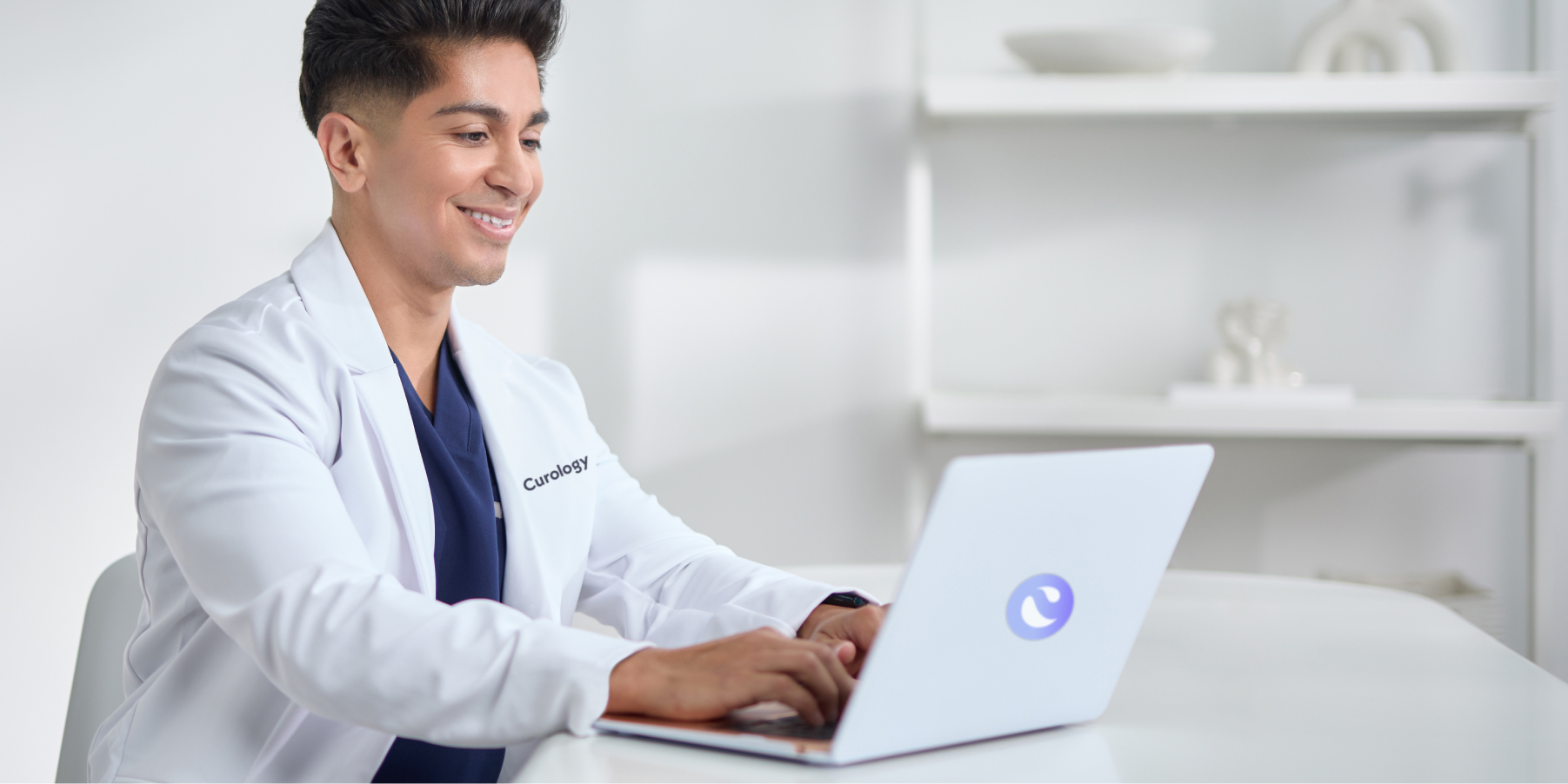 Curology dermatology provider using a laptop during an online skincare consultation