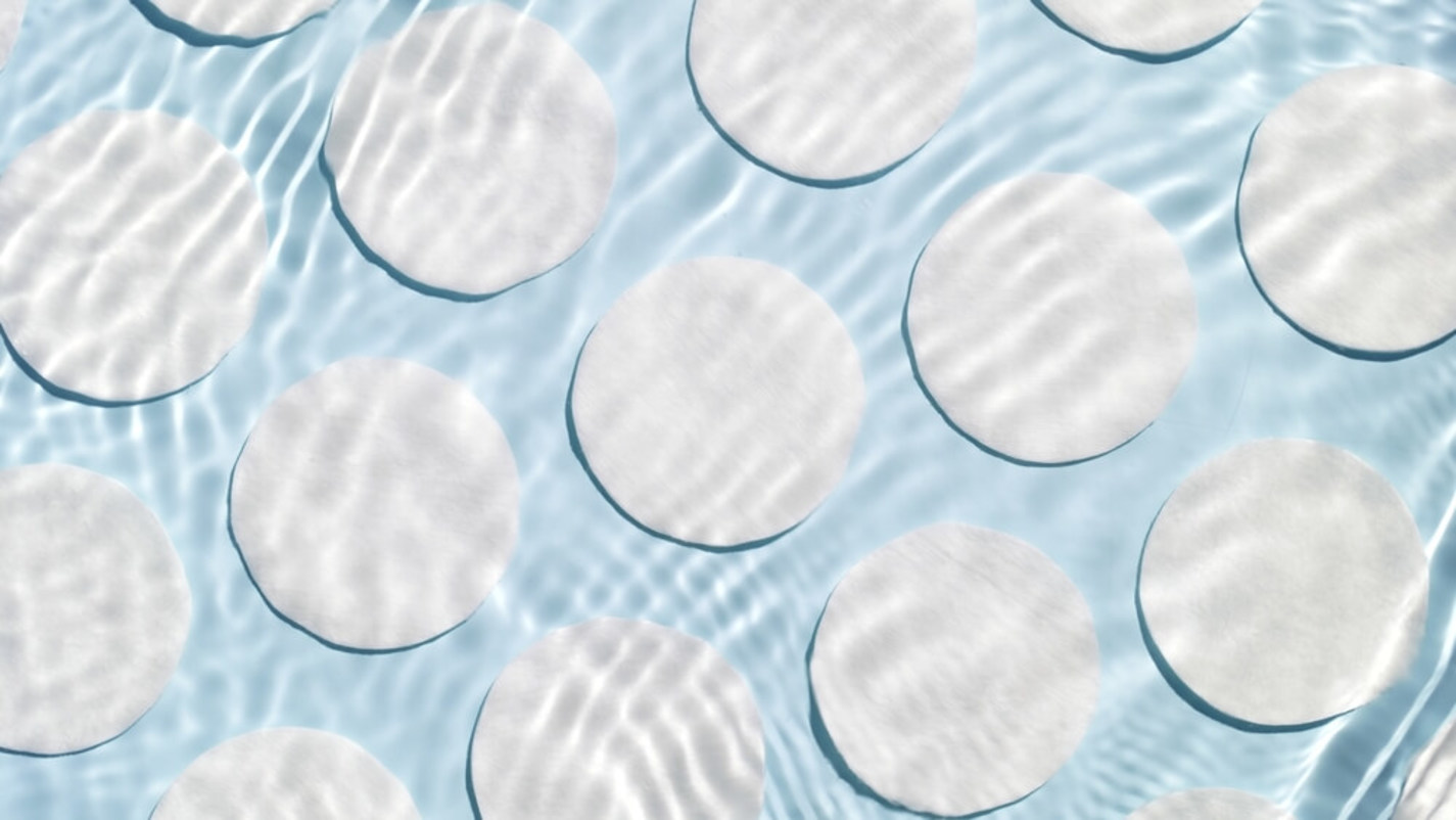 Water Ripples Past Cotton Pads