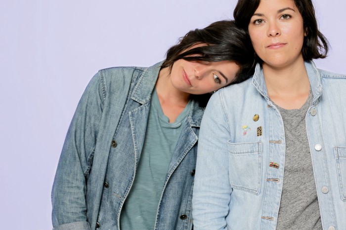 Woman with head on womans shoulder