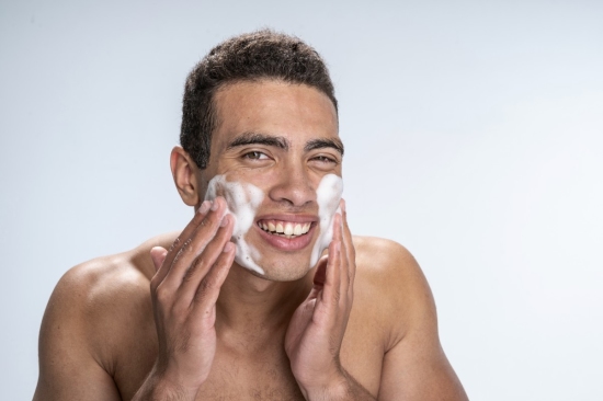man washing his face