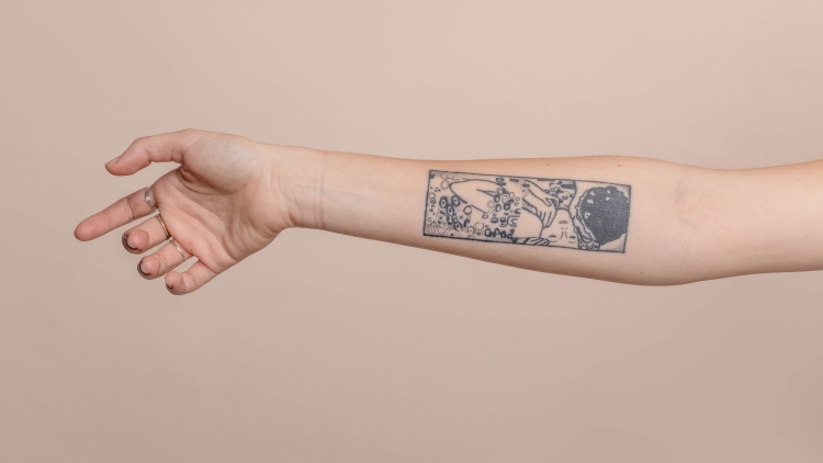 Arm with tattoo and neutral background