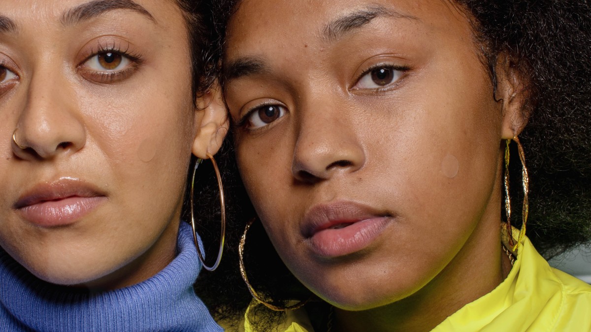 Closeup of women with acne spot patches