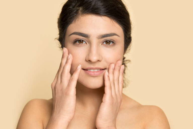 How to improve dehydrated skin, according to the experts - young indian woman portrait