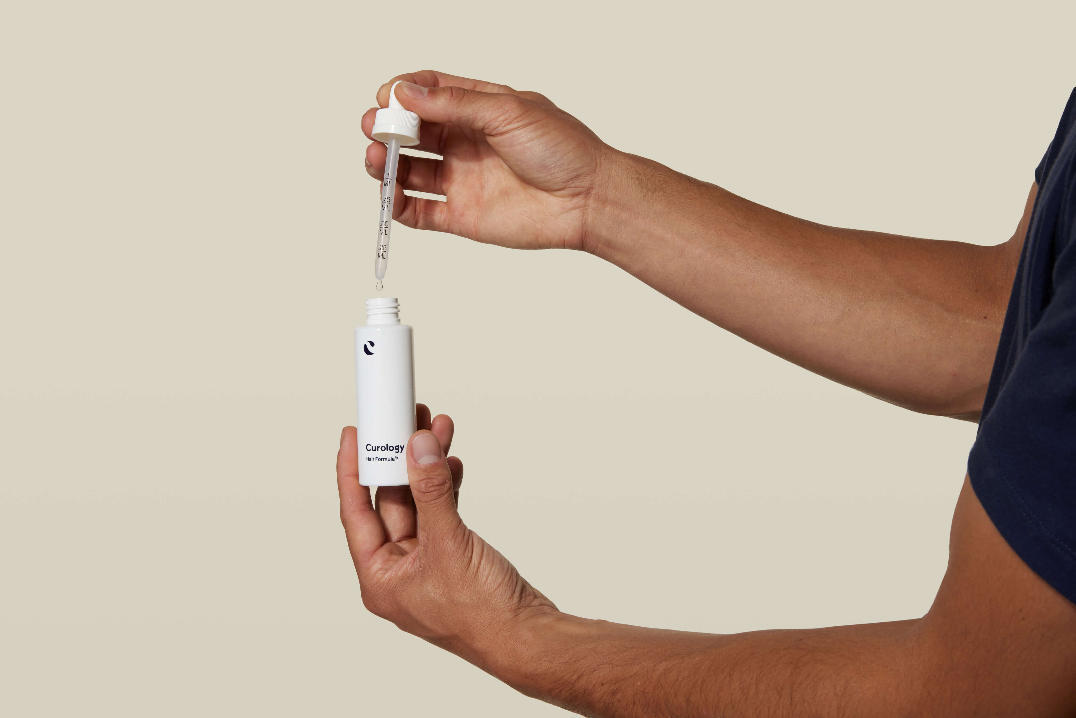 Male hand with dropper