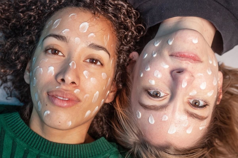 Two friends with dotted face paint