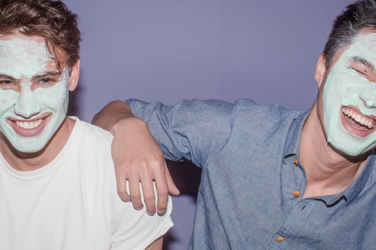 Men with face masks and purple background