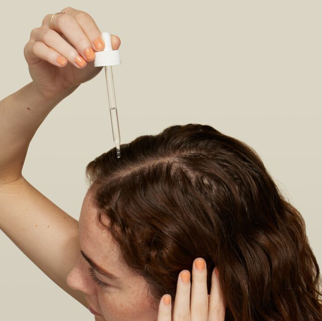 Female Patient Using Hair Formula Dropped