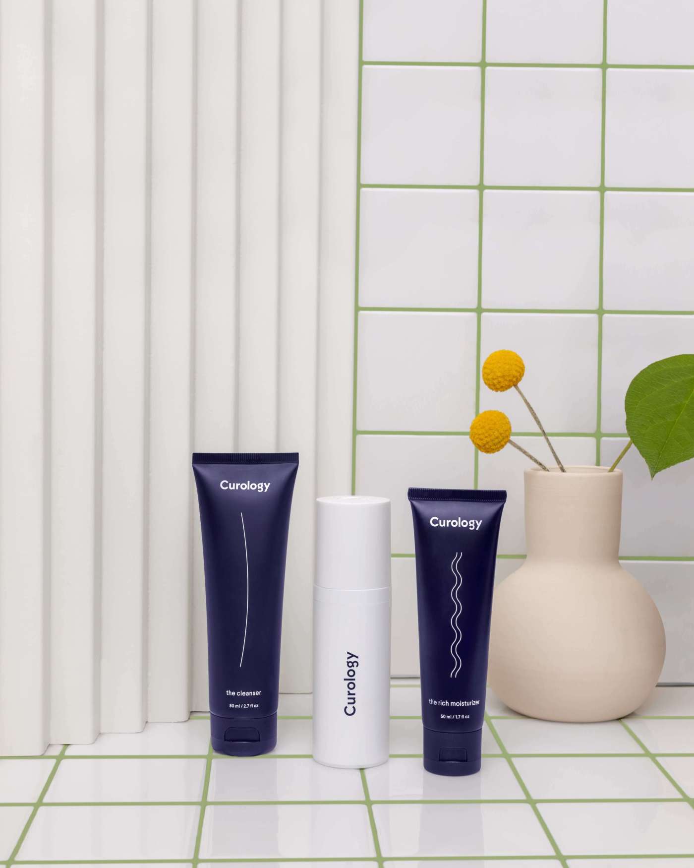 Cleanser, formula, moisturizer trio on tile