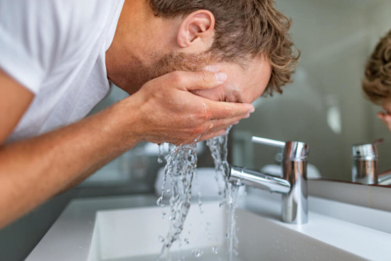 Man Washing Acne