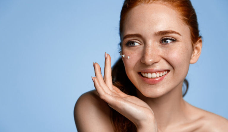 Fair Skin Woman Applying Sunscreen to Face