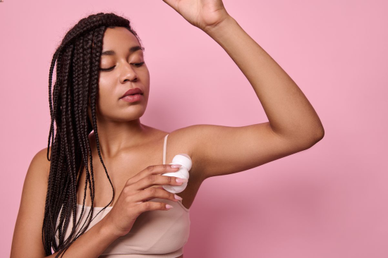 Young Woman Raising her Arm and Showing Clean Underarm