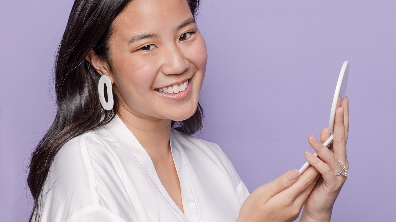 Woman holding mirror