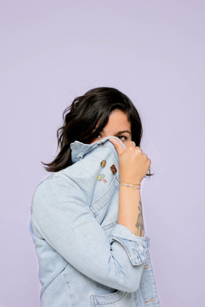 woman with jacket over her face