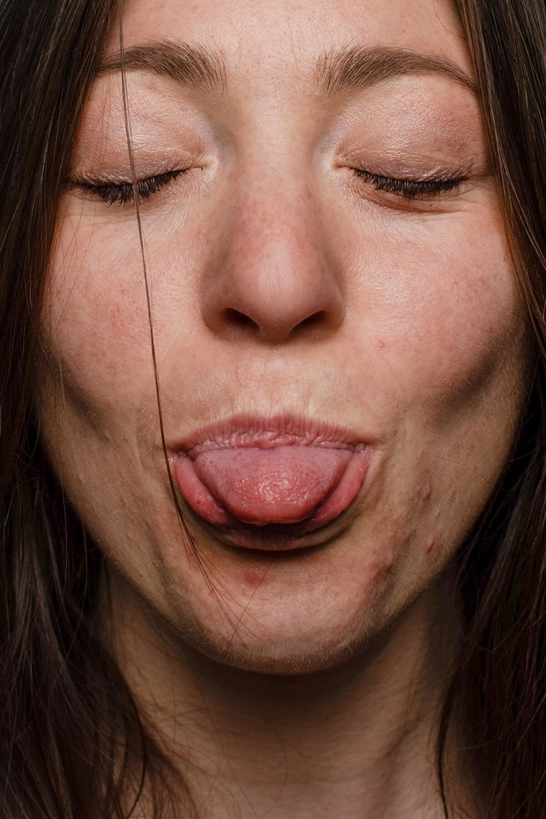 Closeup of woman with tongue out