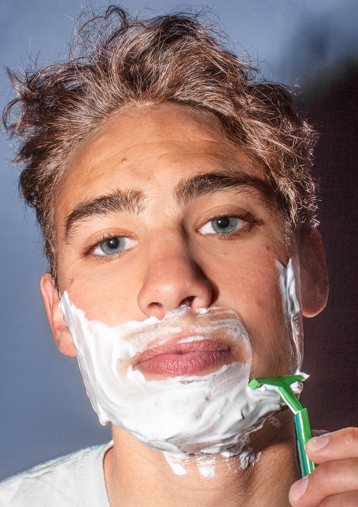 Closeup of man shaving