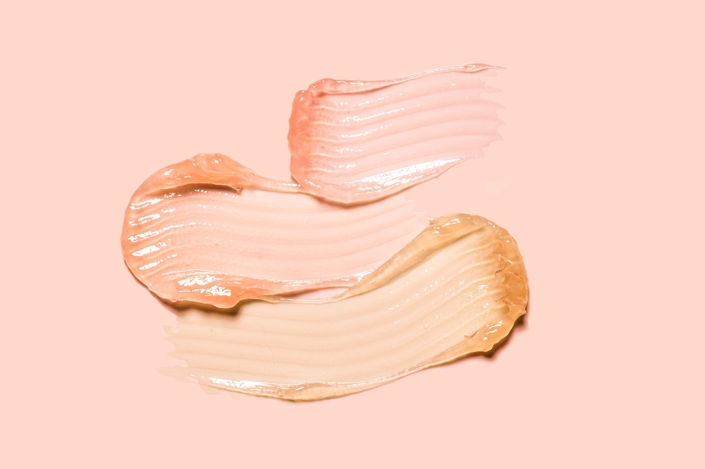 cosmetic transparent product over pink surface