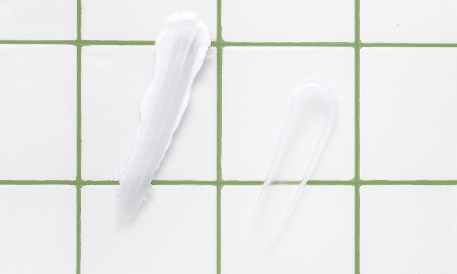 Skincare cream on white tiles