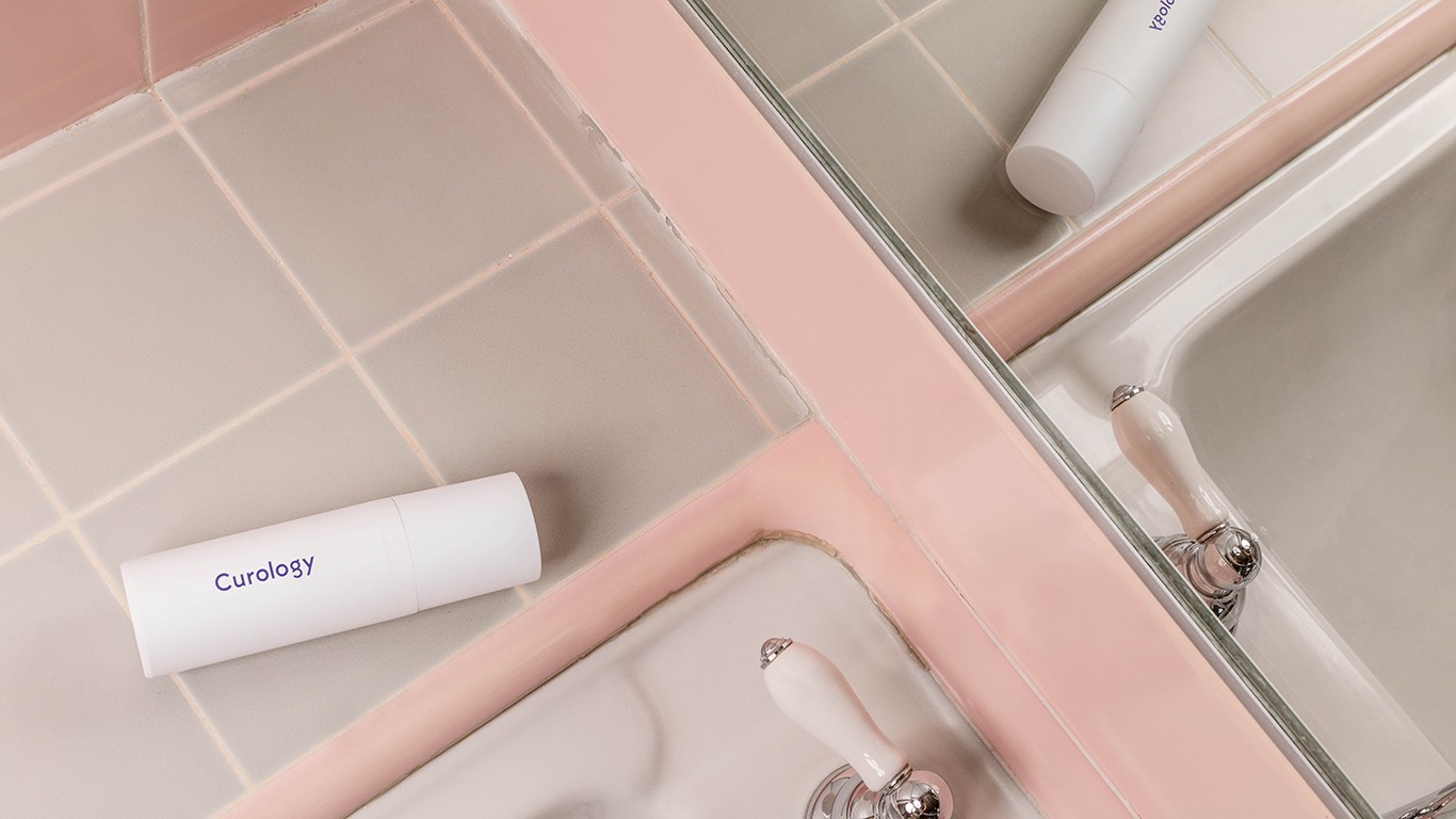 Curology bottle on pink sink