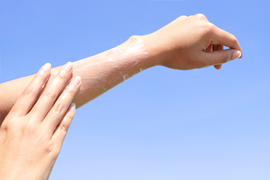 sunscreen application on arm