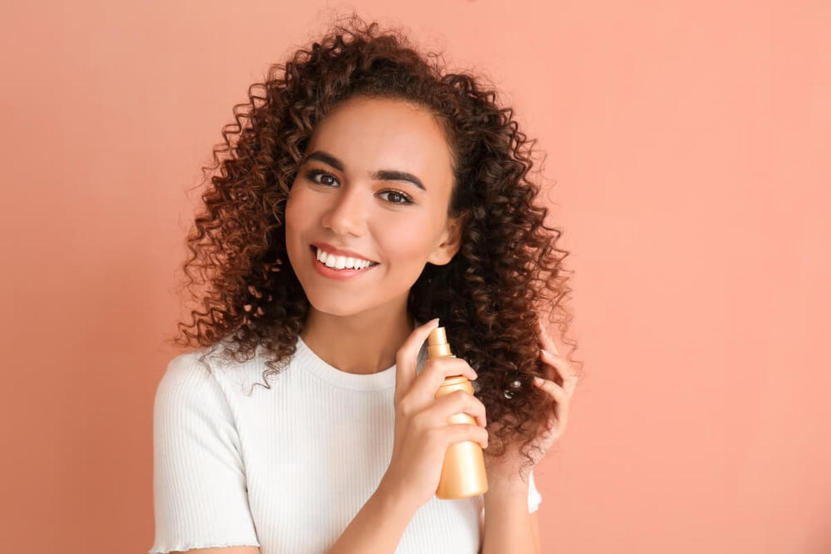 Woman Spraying Hair