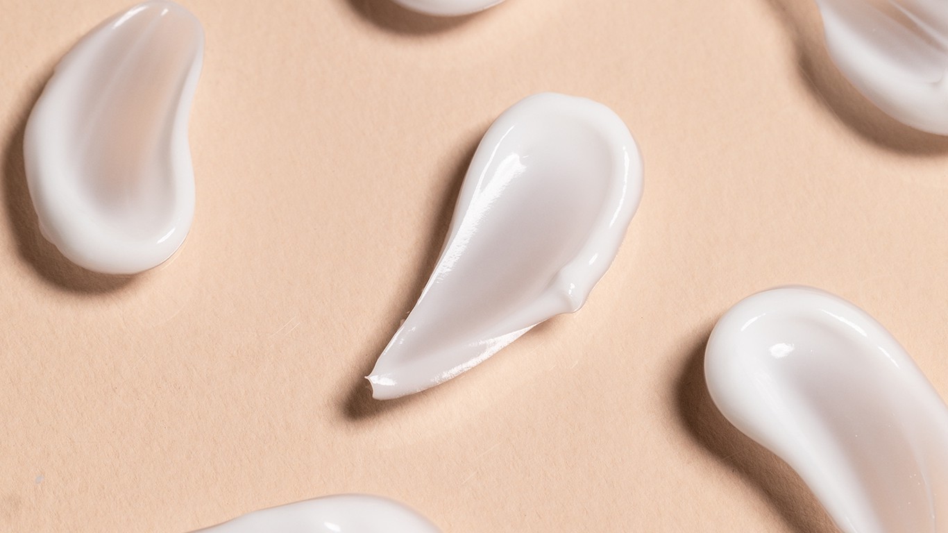 Globs of cream against a neutral background