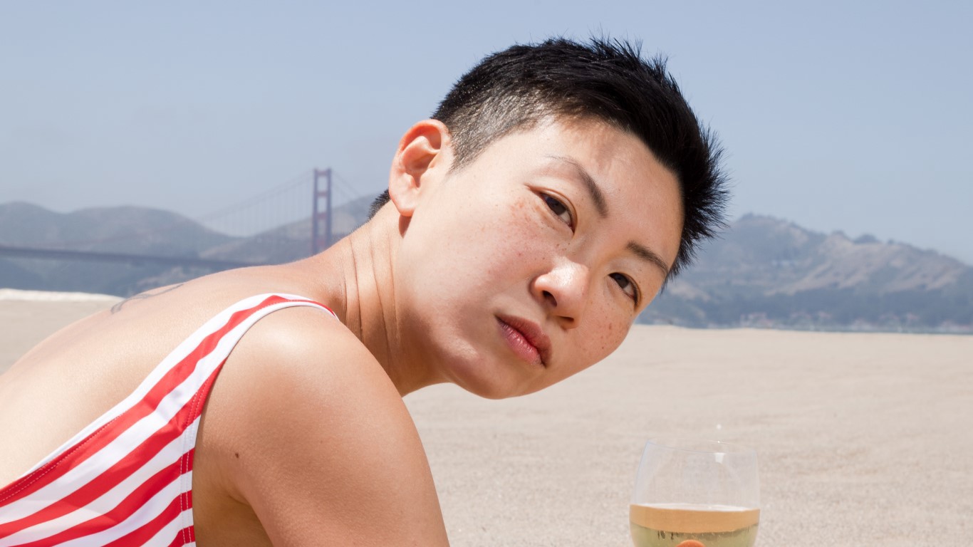 Woman at the beach in front of golden gate bridge