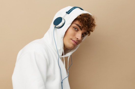 man wearing a hoodie and headphones