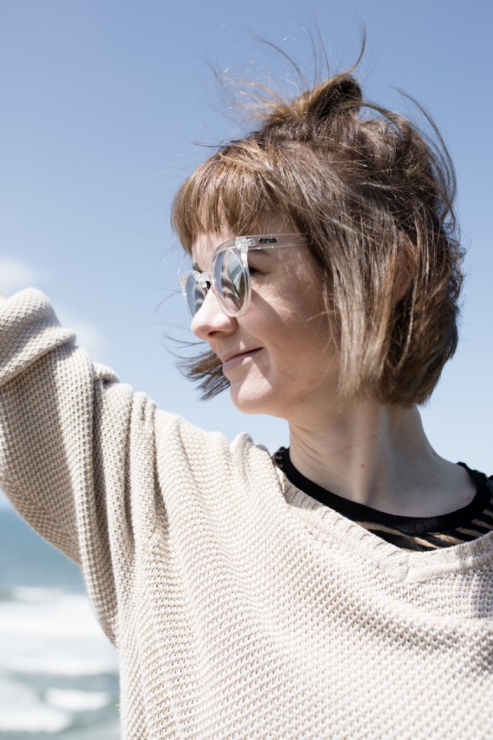 Person smiling and waving