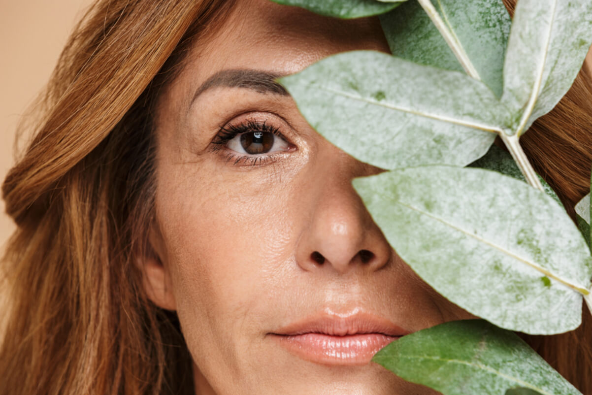 adult woman posing with a leaf