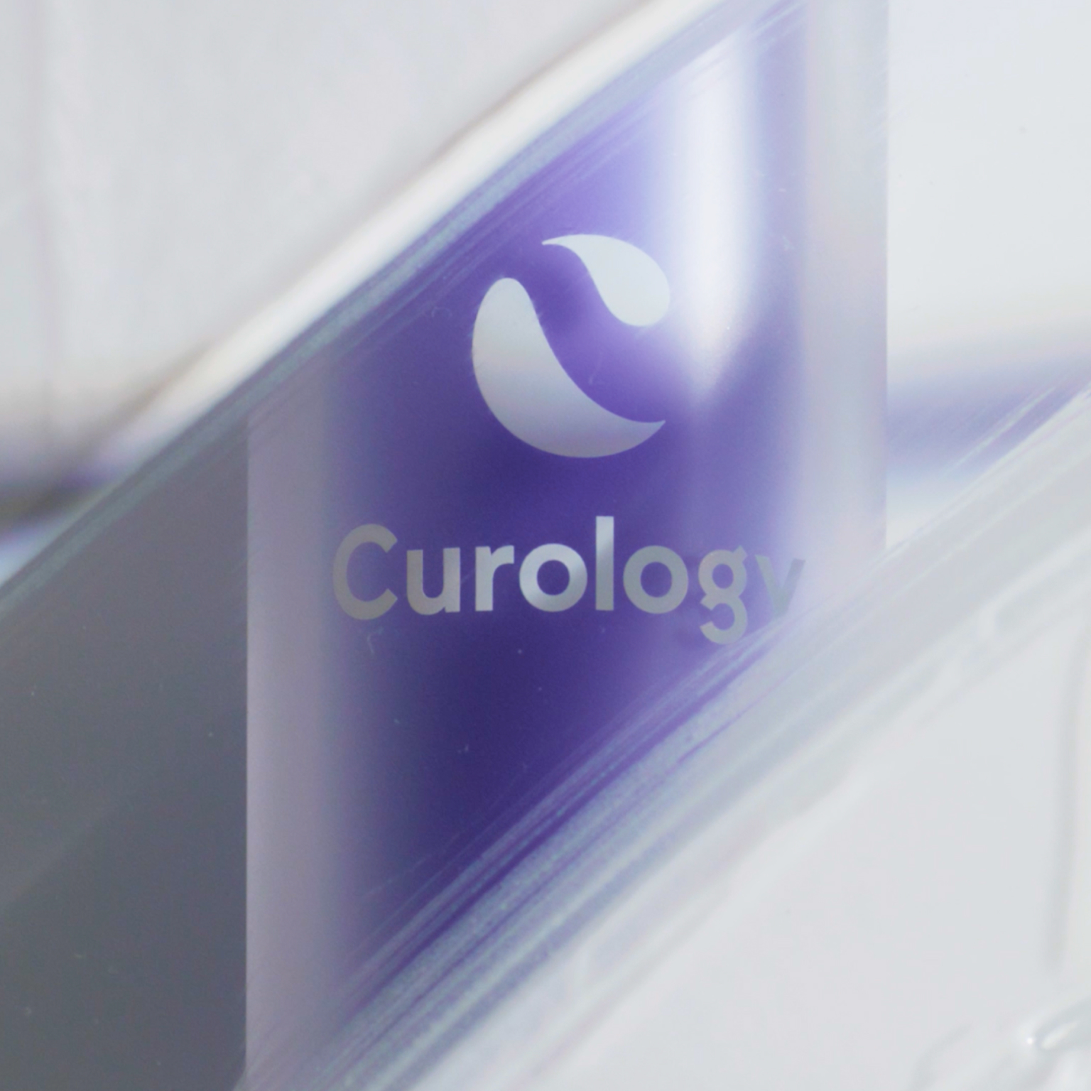 bottle of Curology DayPrime Rx with product swatch