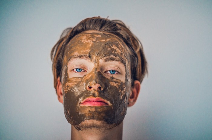 Clay mask on persons face