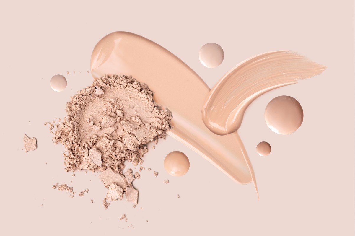 makeup products on biege background