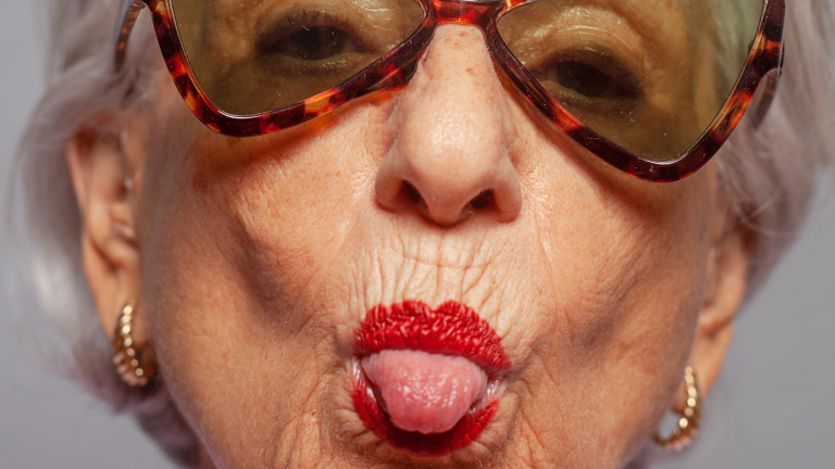 Old woman sticking her tongue out