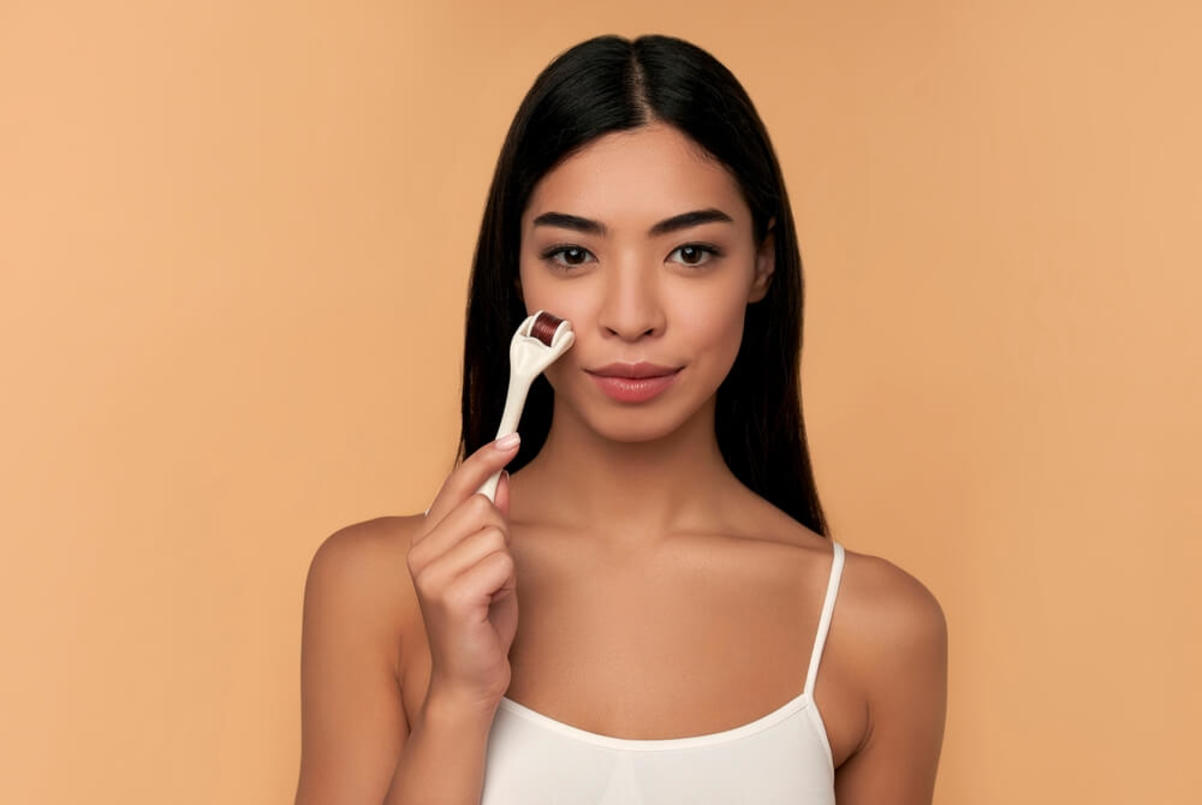 Woman Using a Derma Roller