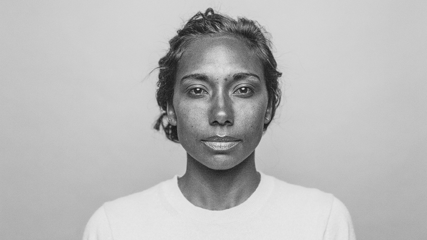 Black and white photo of woman staring at camera