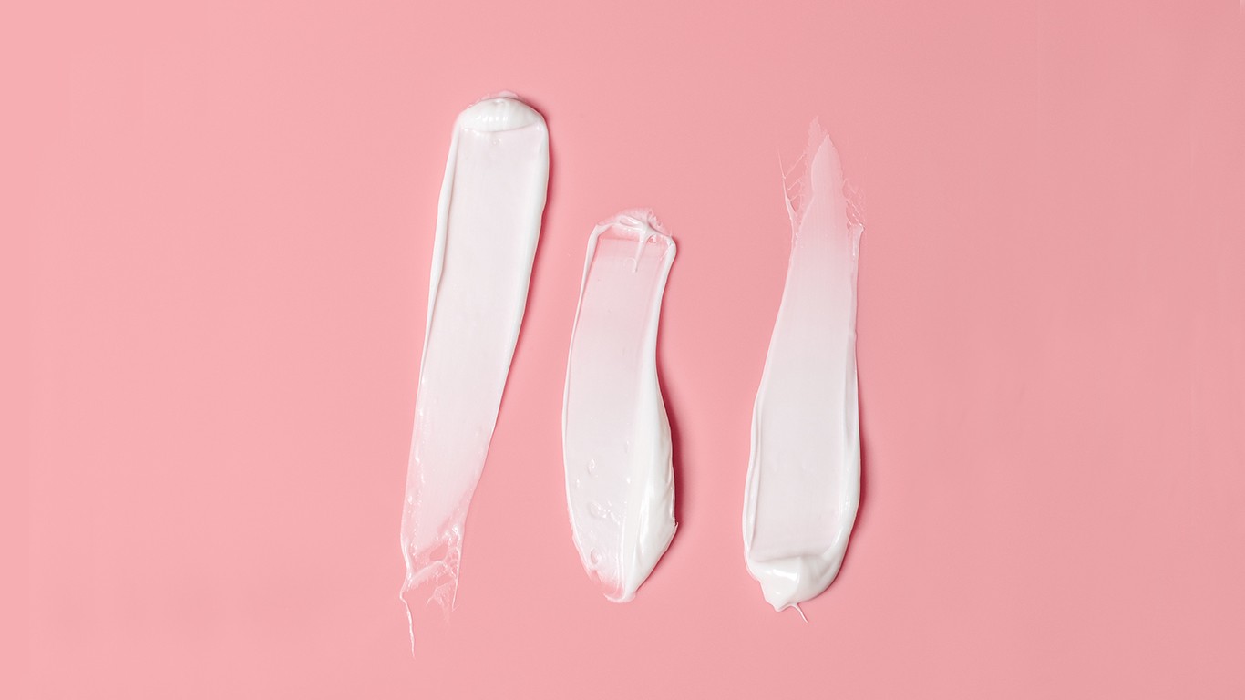 Skincare cream on pink background