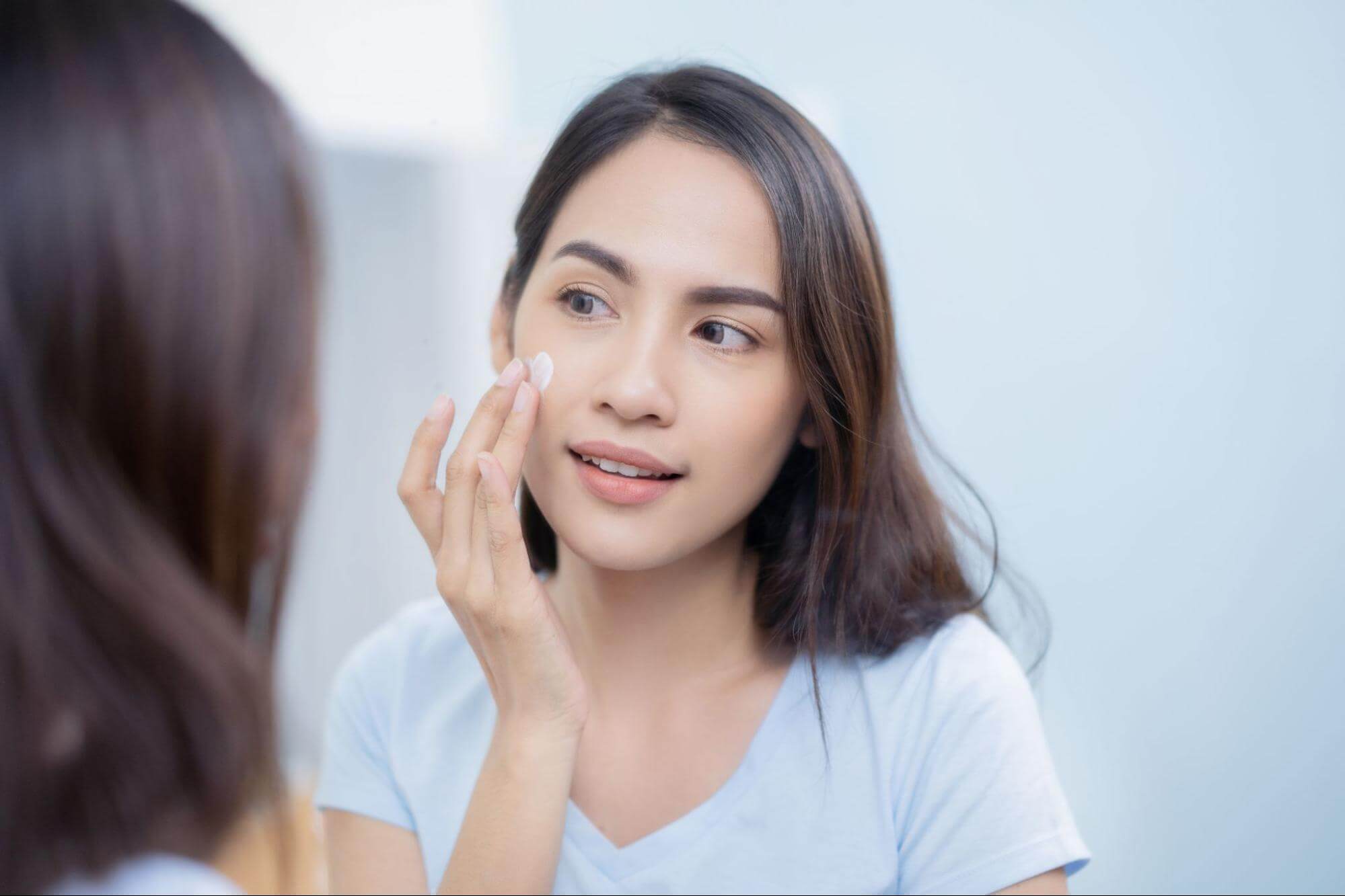 Woman Applying Centella Asiatica to Skin