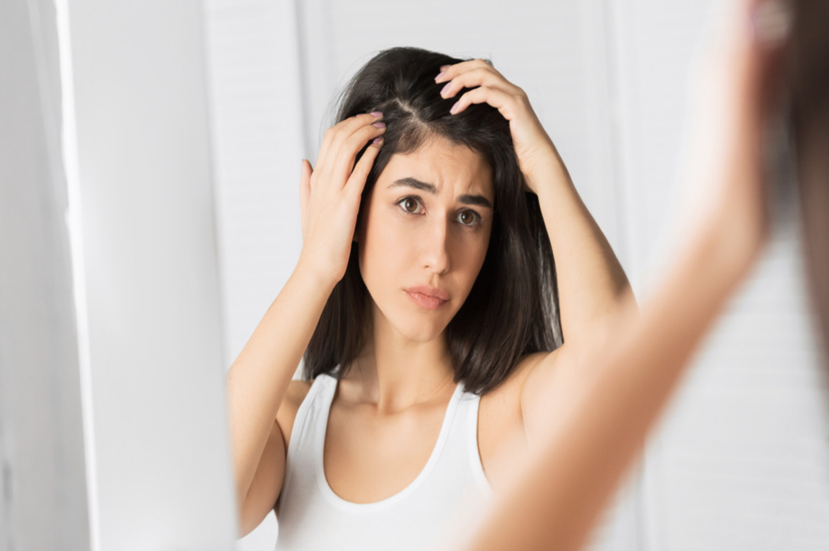 woman concerned about dandruff problem